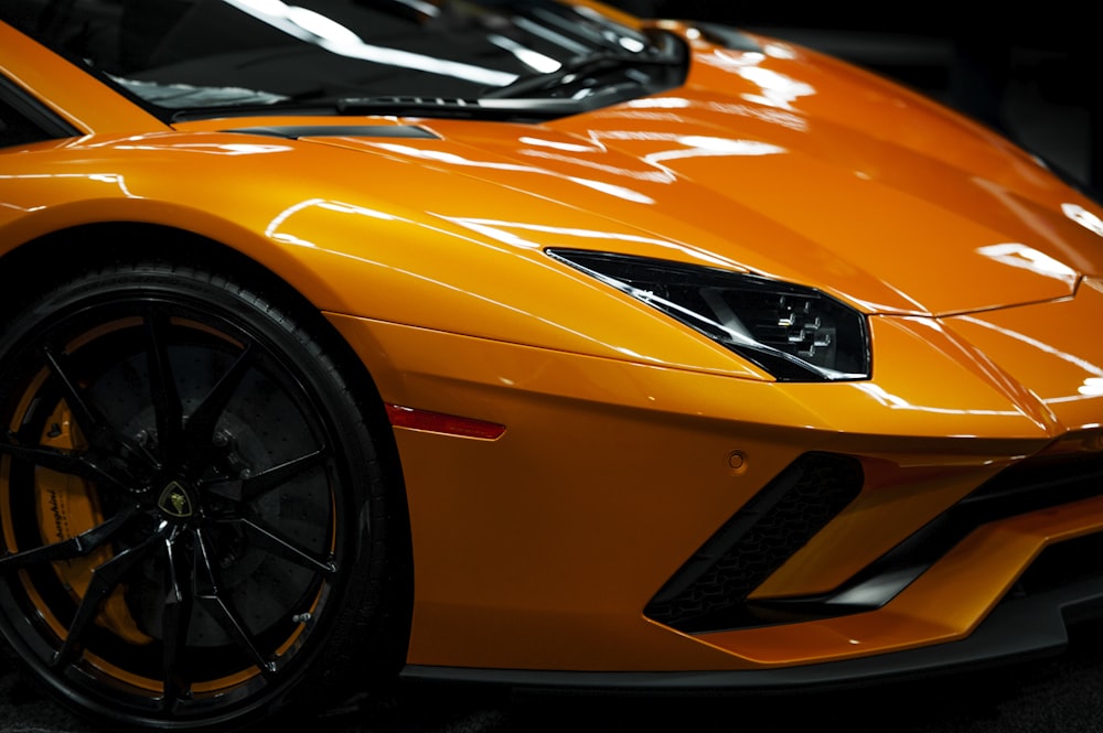 Orange sports car with a high-gloss finish, the result of a good automotive paint job
